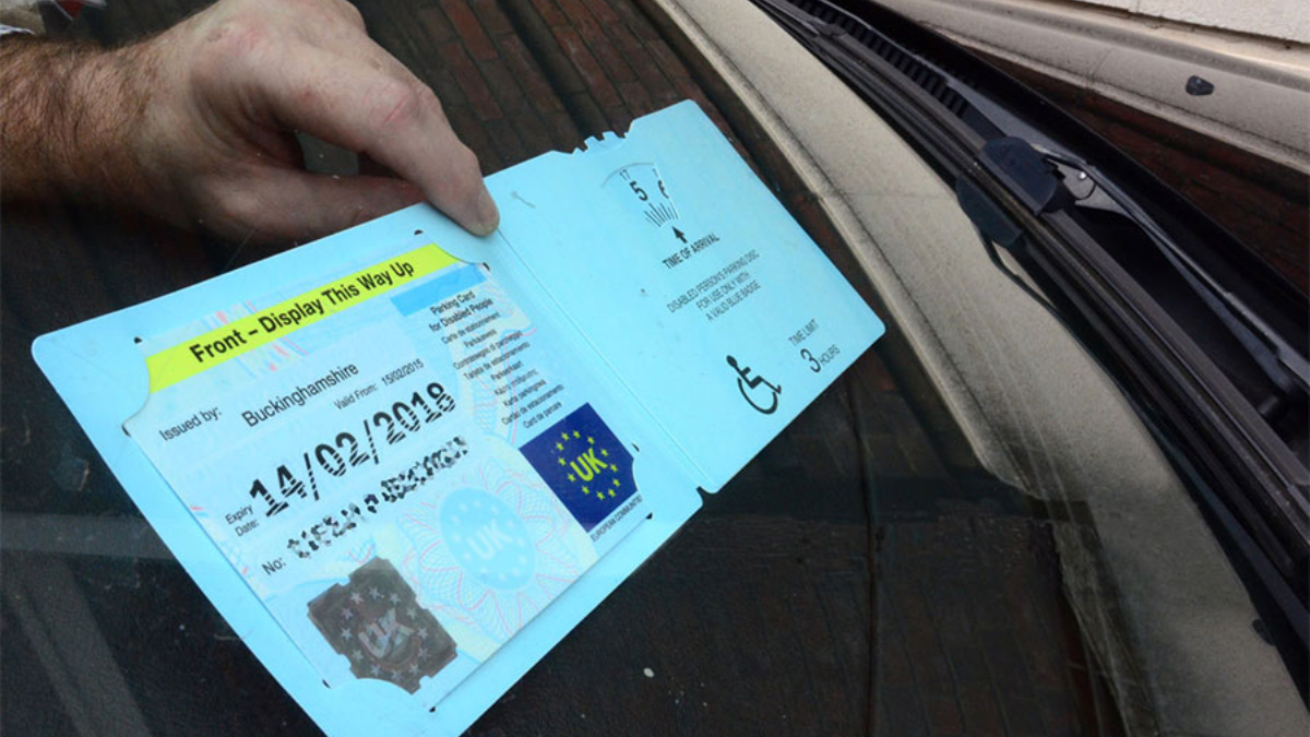 blue badge in car window